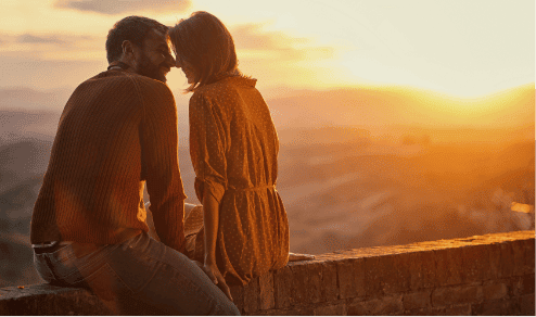 romantic couple watching sunset