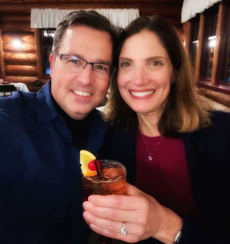 middle-aged couple enjoying their drinks