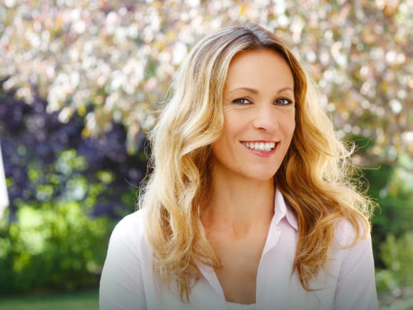 woman with a lovely smile wearing a white top