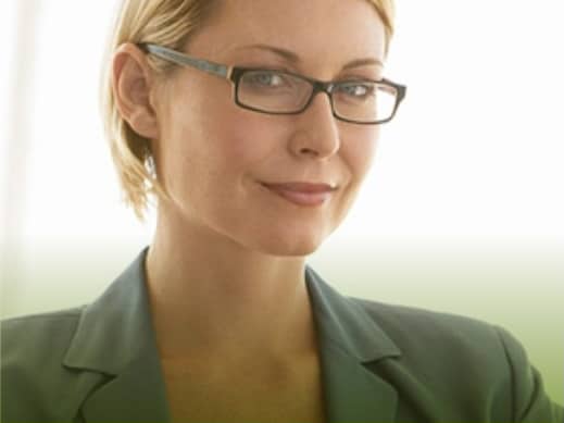 smart, independent woman wearing formal attire with eyeglasses