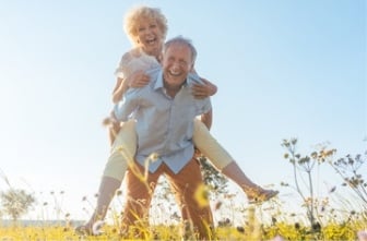 old husband carrying his old wife on his back