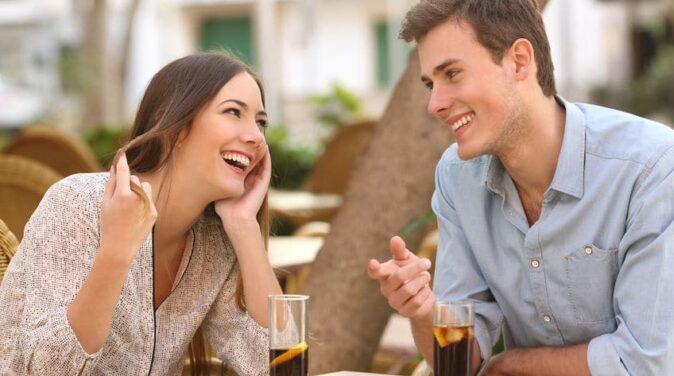 young sweet couple flirting with each other on a date