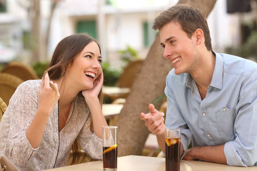 young sweet couple flirting with each other on a date