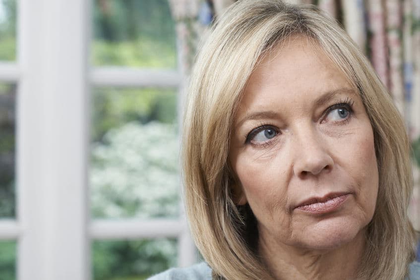 head portrait of unhappy mature lady