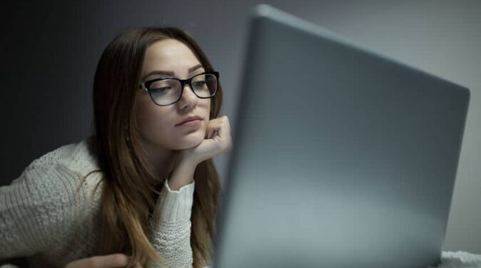 woman using laptop for online dating